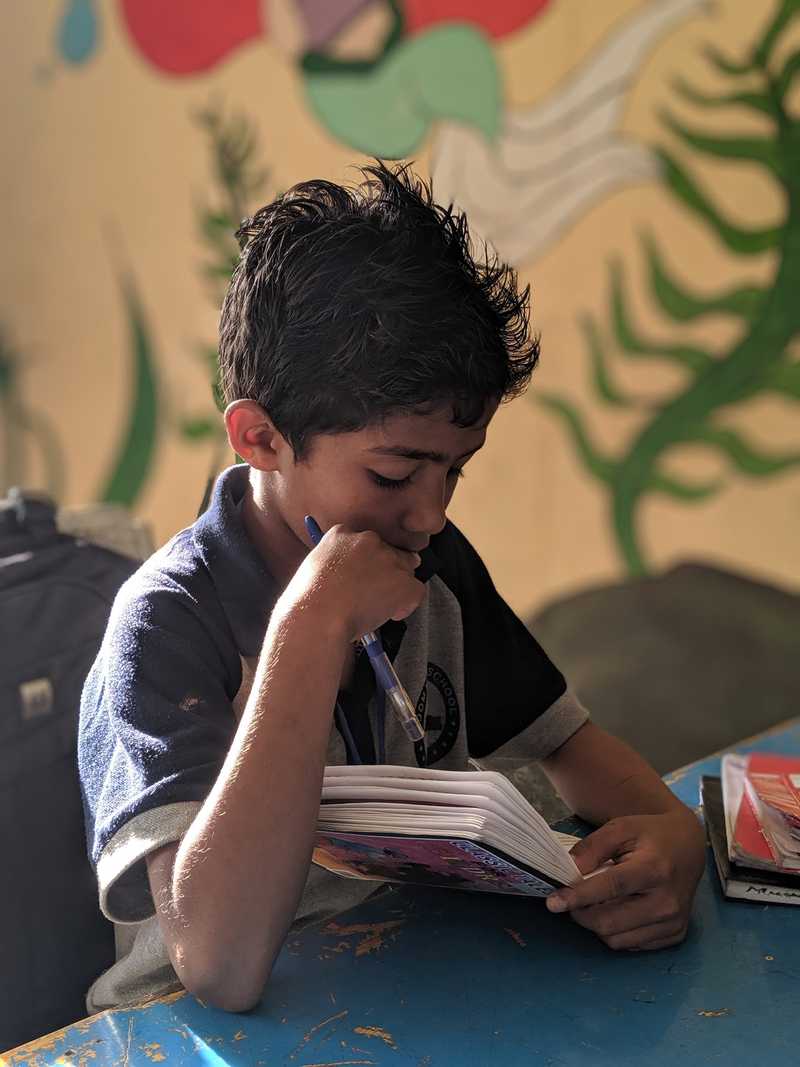 Students watching a video on a laptop